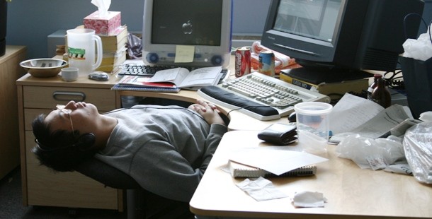 Ways to stay awake, a person sleeping at a desk with a computer