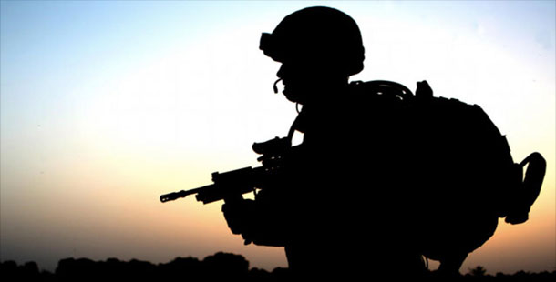 A silhouette of a soldier holding a gun