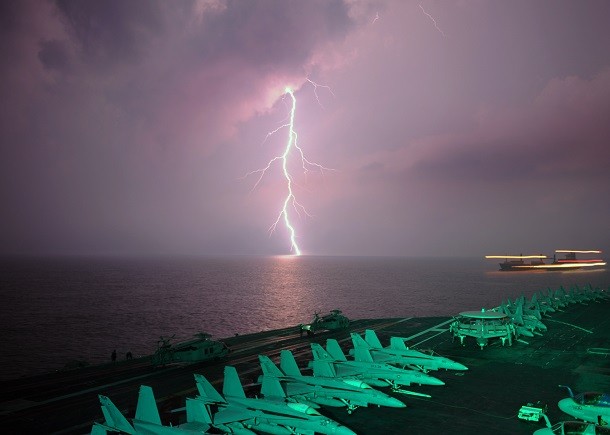 Lighting flashes as the aircraft carrier USS Abraham Lincoln (CVN 72) transits the Straight of Malacca.