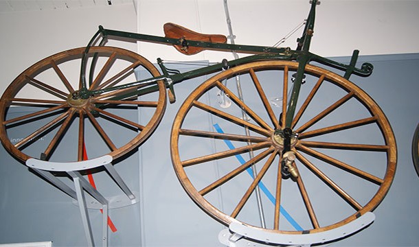 Imagine ride on a wrought iron frame with wooden wheels and tires made of iron. You'd understand the pain.