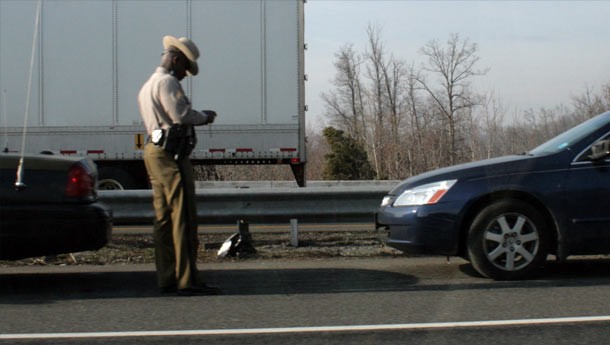 Cop issuing a speeding ticket