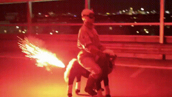 Riding a donkey lit by fireworks