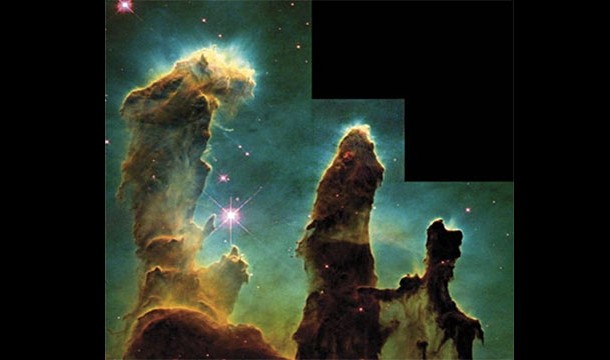 The Pillars of Creation, an area with lots of star birth located in the Eagle Nebula. This color enhanced photo has become one of the Hubble Telescopes most famous (1995)