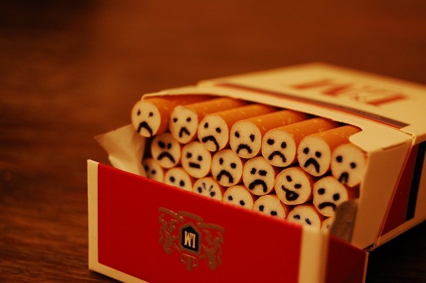 cigarette pack with faces