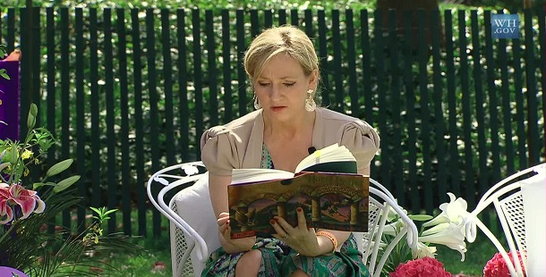 A person sitting in a chair reading best selling book