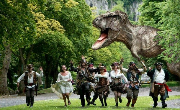 pirates chased by dinosaur