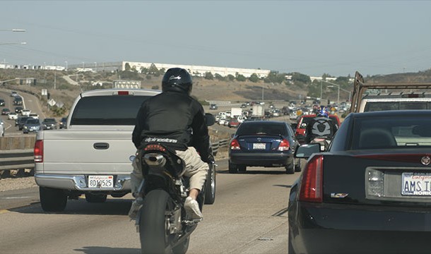 In California it is legal to drive a motorcycle between two lanes (and two cars). Known as lane-splitting, most people don't realize that this is in fact legal (53% at last poll)