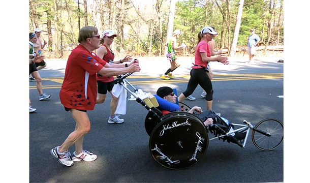 Dick Hoyt ran 247 triathlons while pushing, pulling, or carrying his disabled son