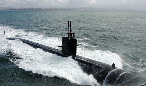 The crew of a submerged nuclear submarine are actually exposed to less radiation than somebody standing on dry ground. This is due to various factors, including less background radiation.