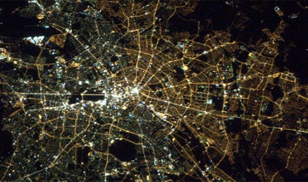 The former dividing line between east and west Berlin can still be seen from space. West Berlin uses modern white colored lights while east Berlin still uses older yellow colored lights.