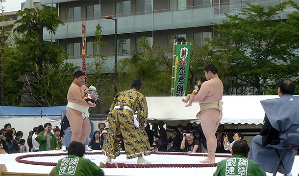 The "Crying Sumo" contest has sumo wrestlers competing to see who can make a baby cry first
