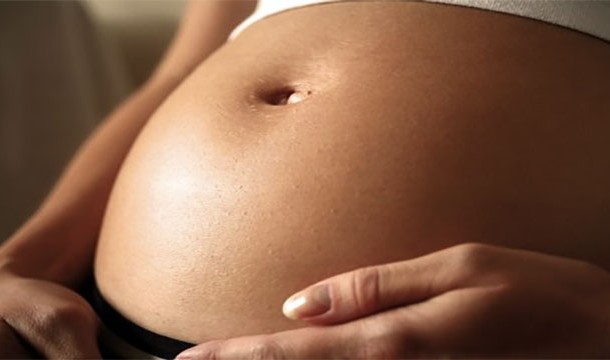 Rubbing pregnant women's stomachs