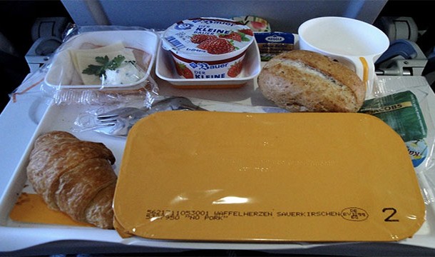 Both pilots are served different meals and they cannot share. This is done to prevent food poisoning.