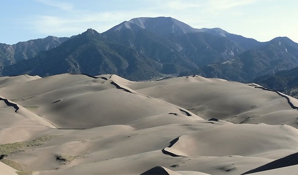 There is a desert in Alaska with dunes over 45 meters high (150 feet). It is known as the Great Kobuk Sand Dunes.