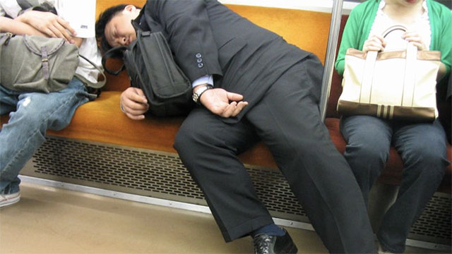 Businessmen passing out in public