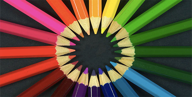 A group of colored pencils arranged in a circle