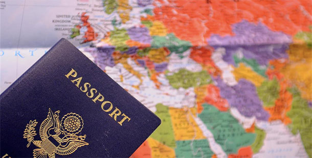 A passport in front of a map