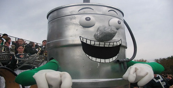 A silver barrel mascots with a face painted on it