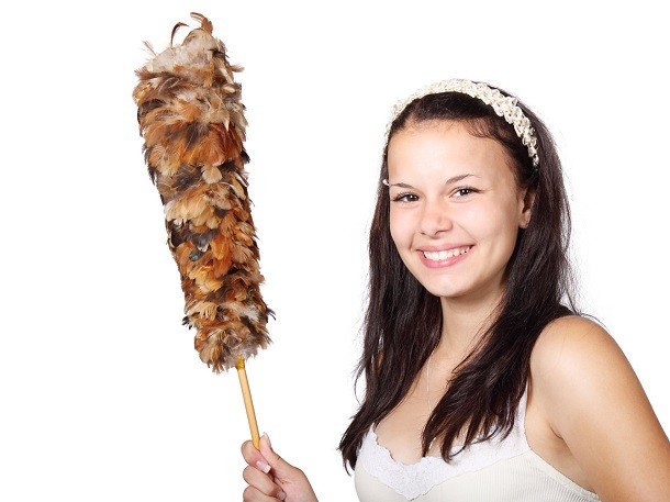 girl with cleaning duster