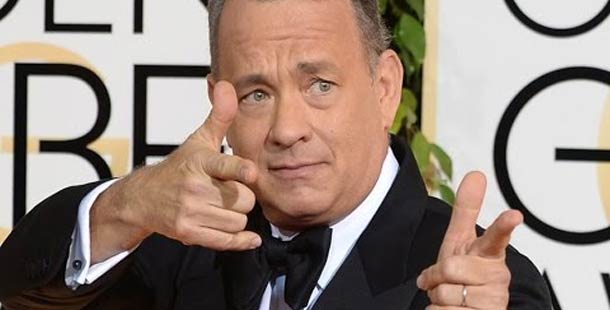 A cool facts about tom hanks in a suit pointing his fingers