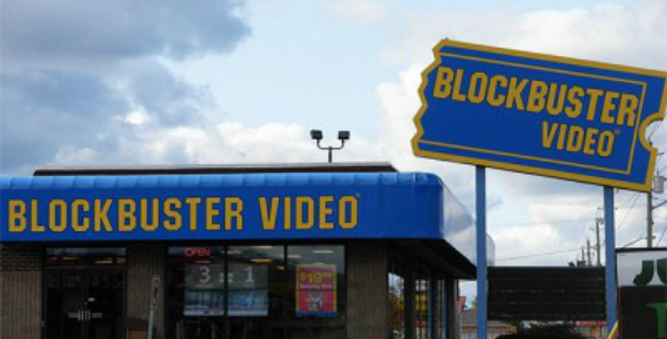 A blue sign with yellow text