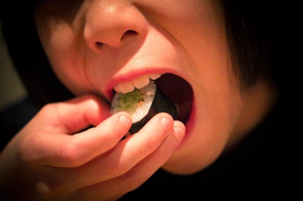 girl eating sushi