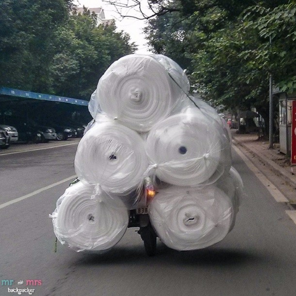 Rolls-of-Foam-on-a-Motorbike-in-Vietnam