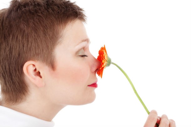 woman-smelling-flowers