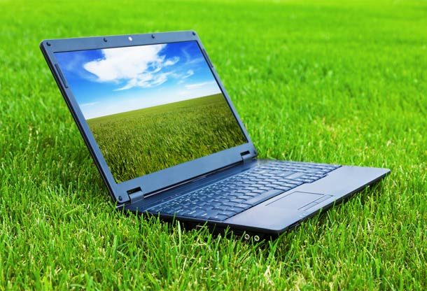 Laptop on grass with grass screen saver