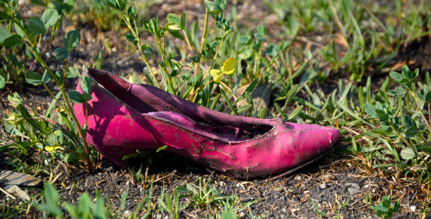 A pink shoe on the ground, unsolved human disappearance