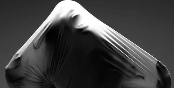 A person covered in a white cloth