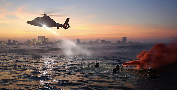 A helicopter rescue stories flying over water