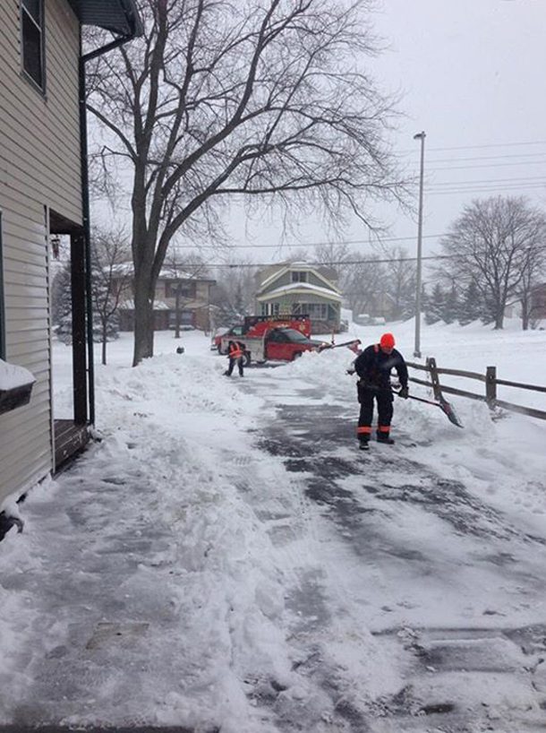 Paramedics shoveling snow