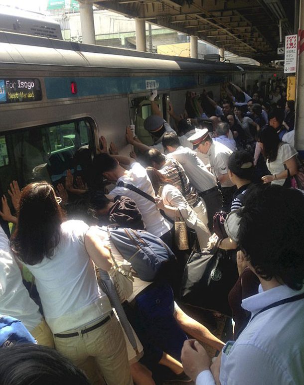 Japanese pushing train to free a woman's leg