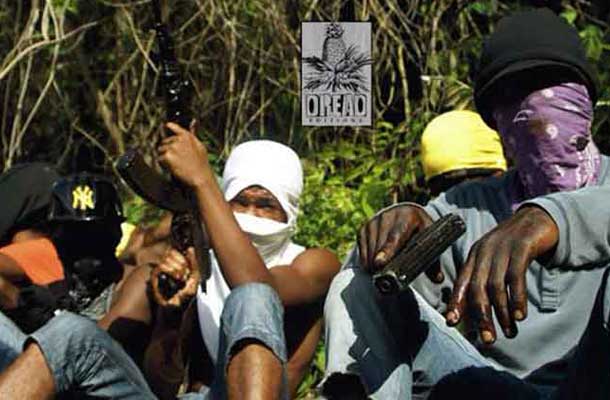 Jamacian Possee members with guns and covered faces