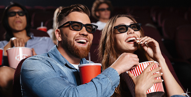 A person and person wearing 3d glasses watching awesome movies