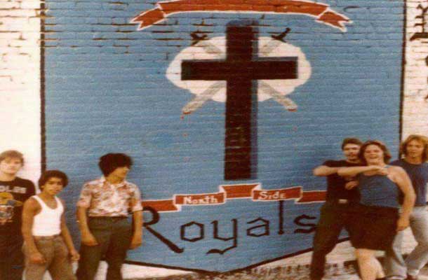Simon City Royals picture in front of mural
