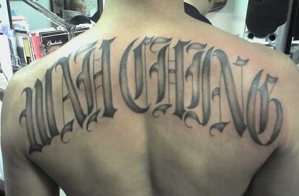 Large font tattoo of a Wah Ching gang member
