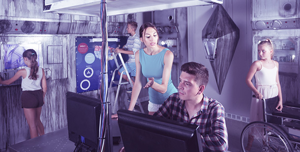 A person and person looking at a computer screen