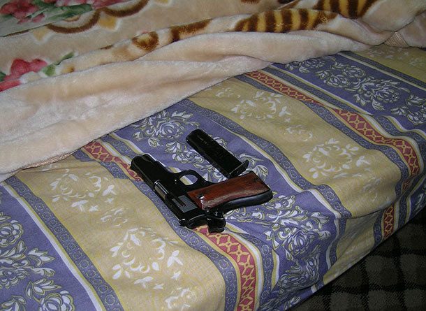 gun on bed