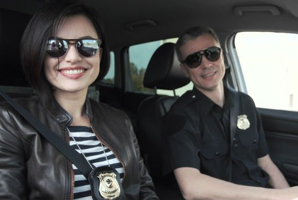 two police officers sitting in a police car