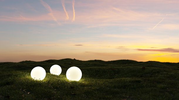 3 glowing orbs on field at dusk