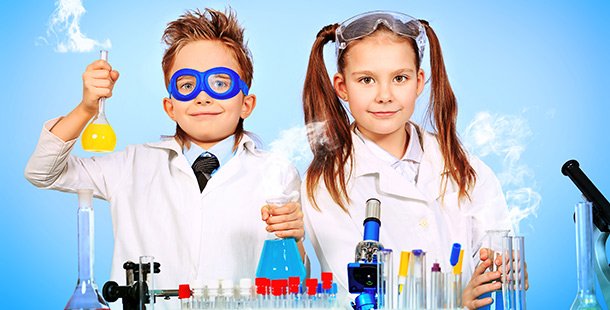 A child and child in lab coats