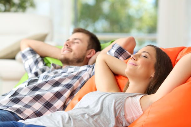 couple on couch breathing fresh air