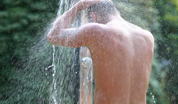 man showering outside