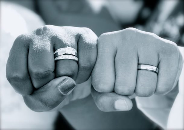 fists showing off wedding rings