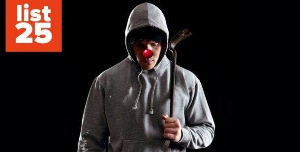 A person in a hoodie holding a crowbar