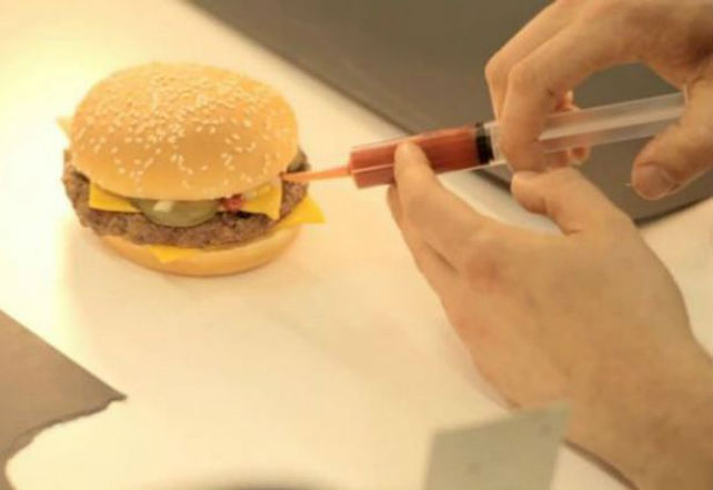 mcdonalds-burger-being-dressed-up-to-look-its-best-for-an-advert-tomato-ketchup-is-being-inserted-via-a-syringe-904355