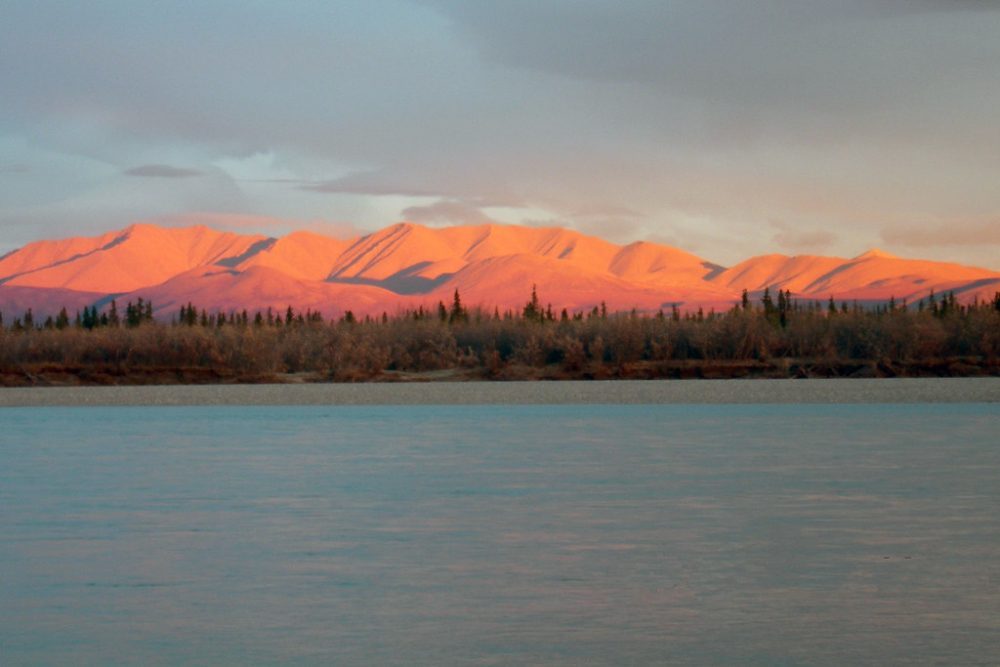 The setting sun casts a spectacular pink light on the Maiyumerak Mountains which lie on the south side of the Noatak River.
